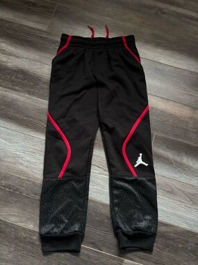 Jordan Kids Black Sweatpants with Red Trim and White Jumpman
